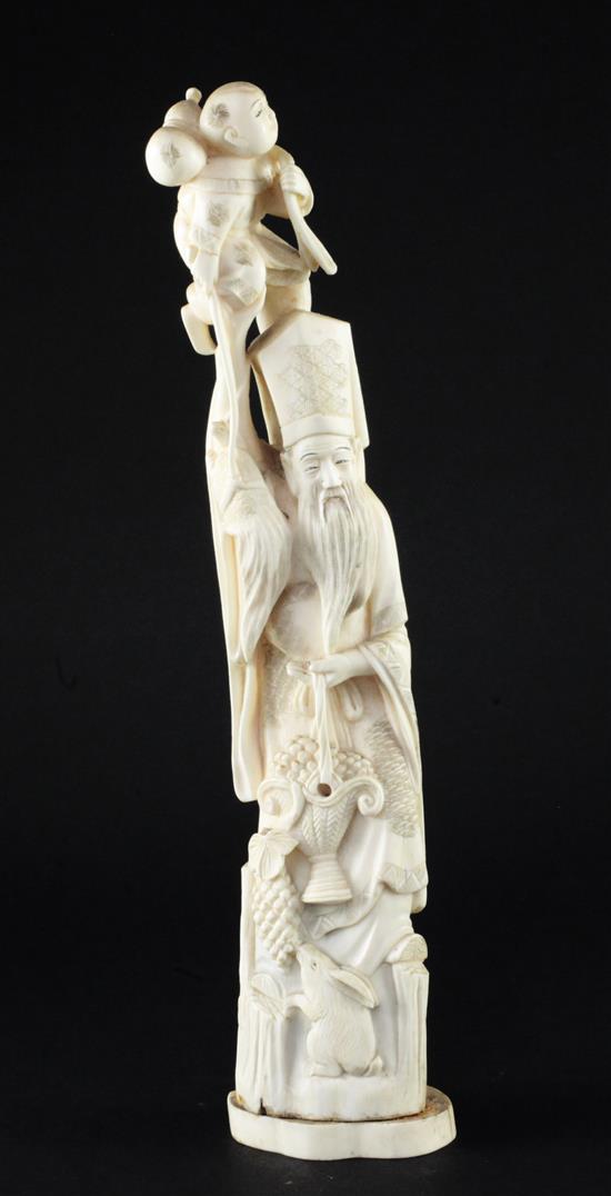 A Japanese walrus ivory tusk carving of Jurojin, early 20th century, 33.5cm